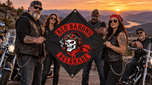 A motorcycle club chapter holds its custom diamond flag at a mountain turnout after a sunset ride with American V-twin motorcycles.