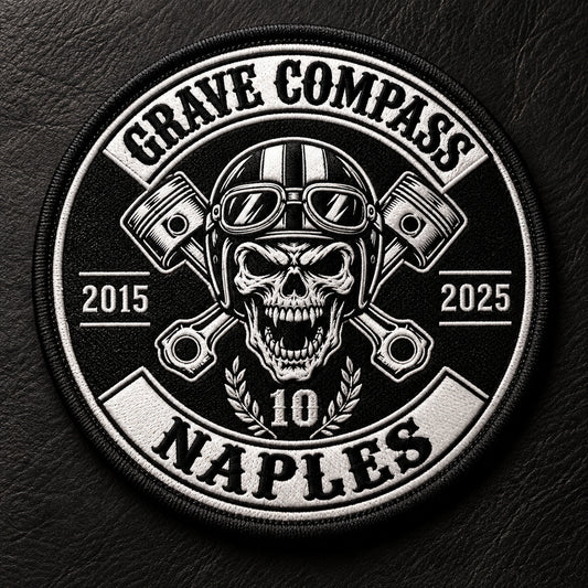 Motorcycle club round anniversary patch with year ring featuring the authorized Grave Compass Naples identity in a dark leather product studio.