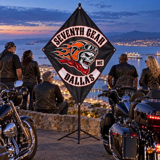 Traveling American V-twin riders display their custom diamond club flag at a harbor overlook at blue hour.