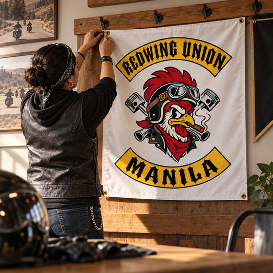 Chapter member adding a custom motorcycle club exchange flag to a club collection wall.