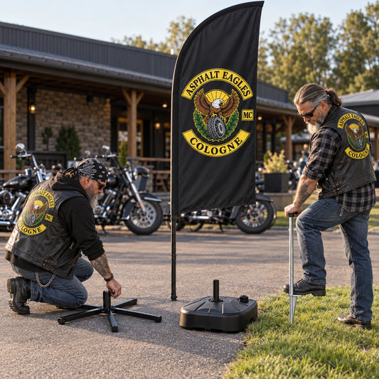 Motorcycle club members comparing a cross base, weighted water base and ground spike for a custom feather flag.