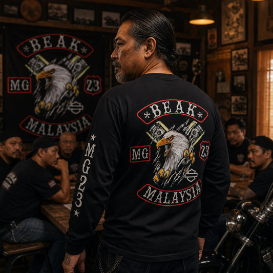 Custom motorcycle club long-sleeve shirt displaying a coordinated club emblem, chapter identity and founding details.