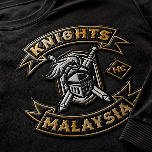 Macro view of high-density raised club lettering on a custom motorcycle club long-sleeve shirt.