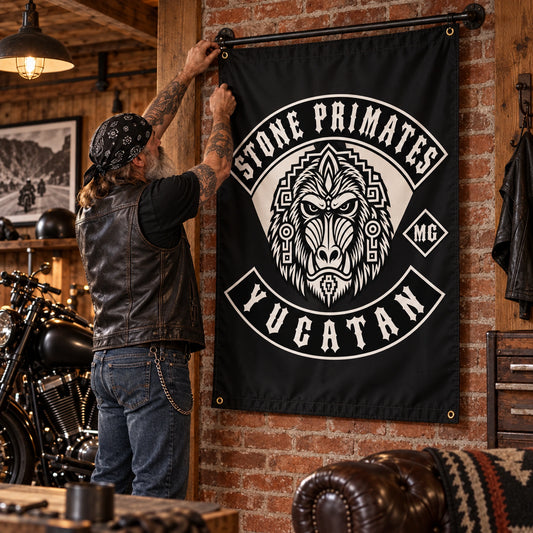 A mature rider mounts a custom vertical motorcycle club flag on the brick wall of a chapter room.