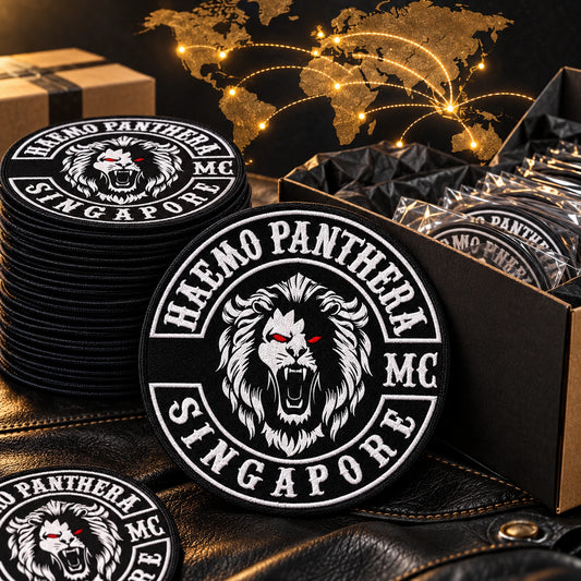 Packed solid patch orders for international chapters shown for a custom motorcycle club patch system in dispatch area with world map.
