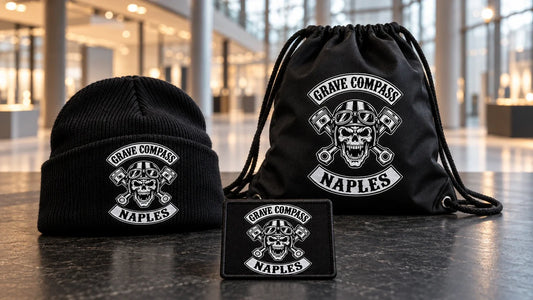 Grave Compass Naples motorcycle club visitor kit with logo beanie, drawstring bag and name bar prepared for a motorcycle show.