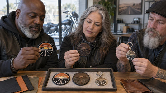 Three club committee members compare matched embroidered, leather and metal keychains in a sample room.