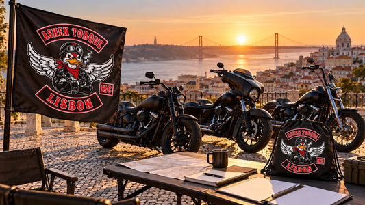Ashen Torque Lisbon motorcycle club route-card preparation area with logo rally flag and drawstring document bag.