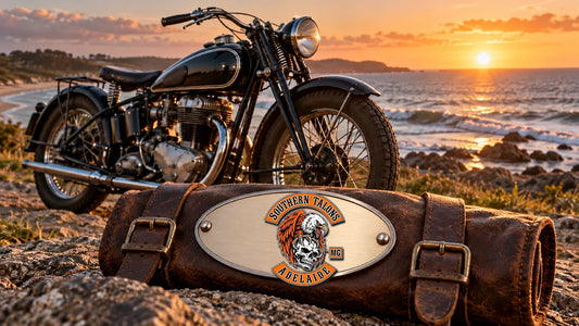 Southern Talons Adelaide club logo integrated directly into a brushed-metal badge on a leather tool roll beside a vintage motorcycle.