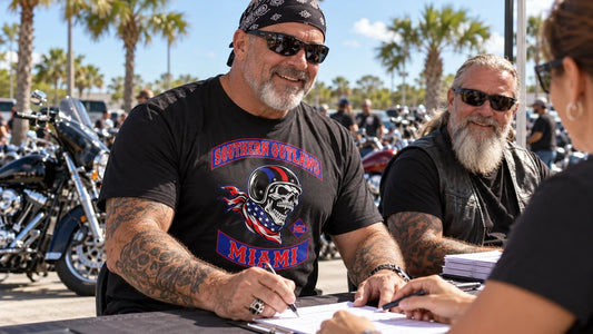 Florida riders organize charity poker-run registration in motorcycle club performance shirts with an integrated Southern Outlaws Miami logo.