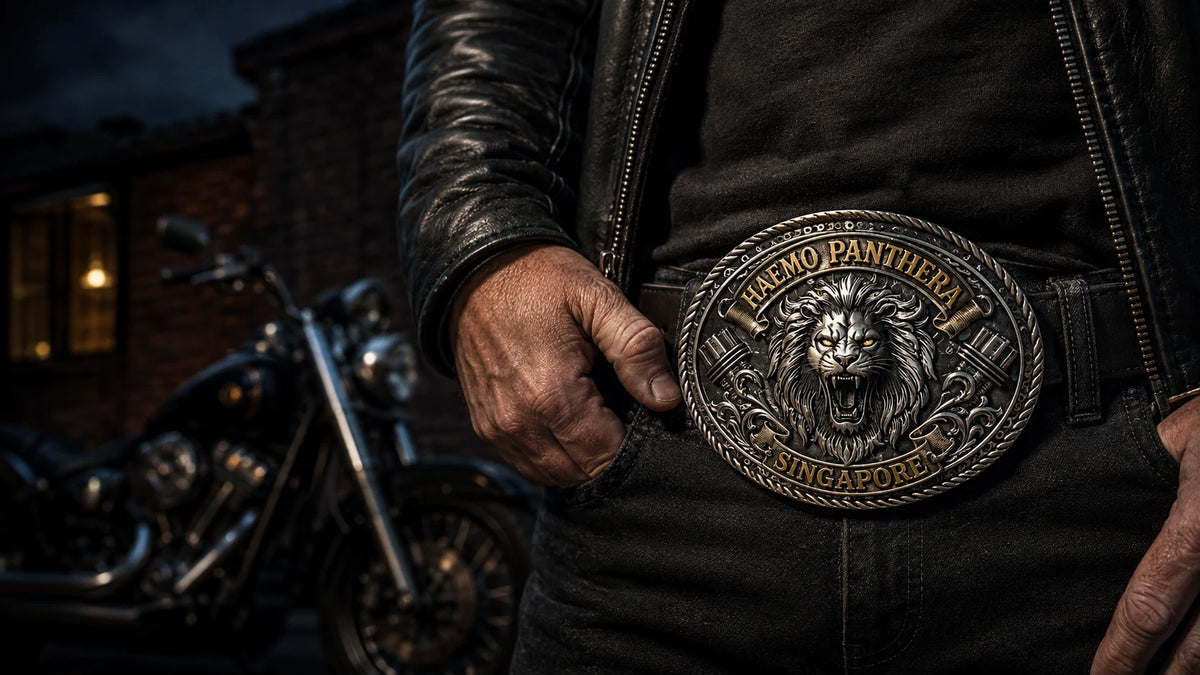 Motorcycle club rider wearing a sculpted Haemo Panthera lion belt buckle in sterling silver and gold-tone metal.