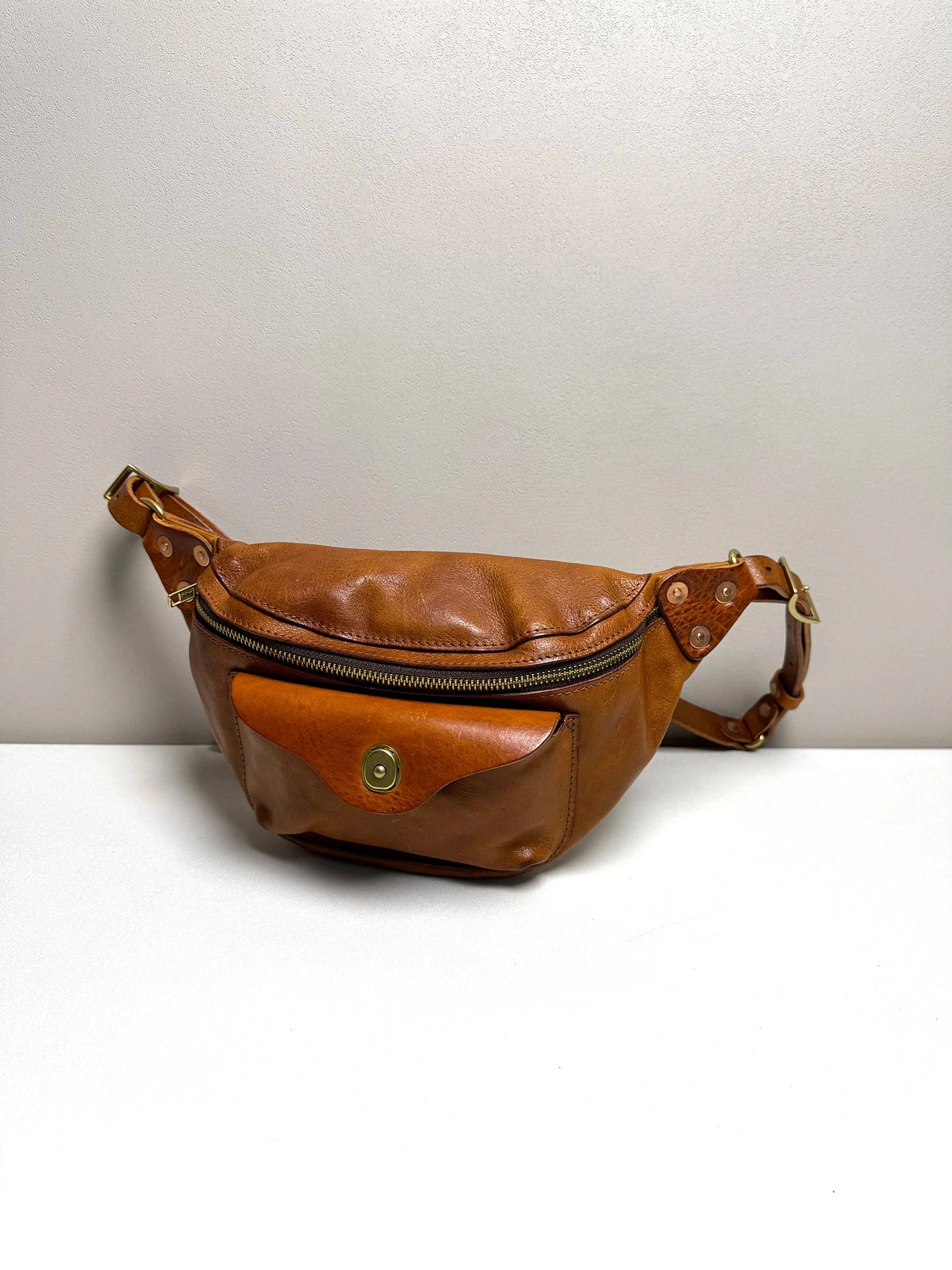 vegetable-tanned leather chest crossbody bag 1