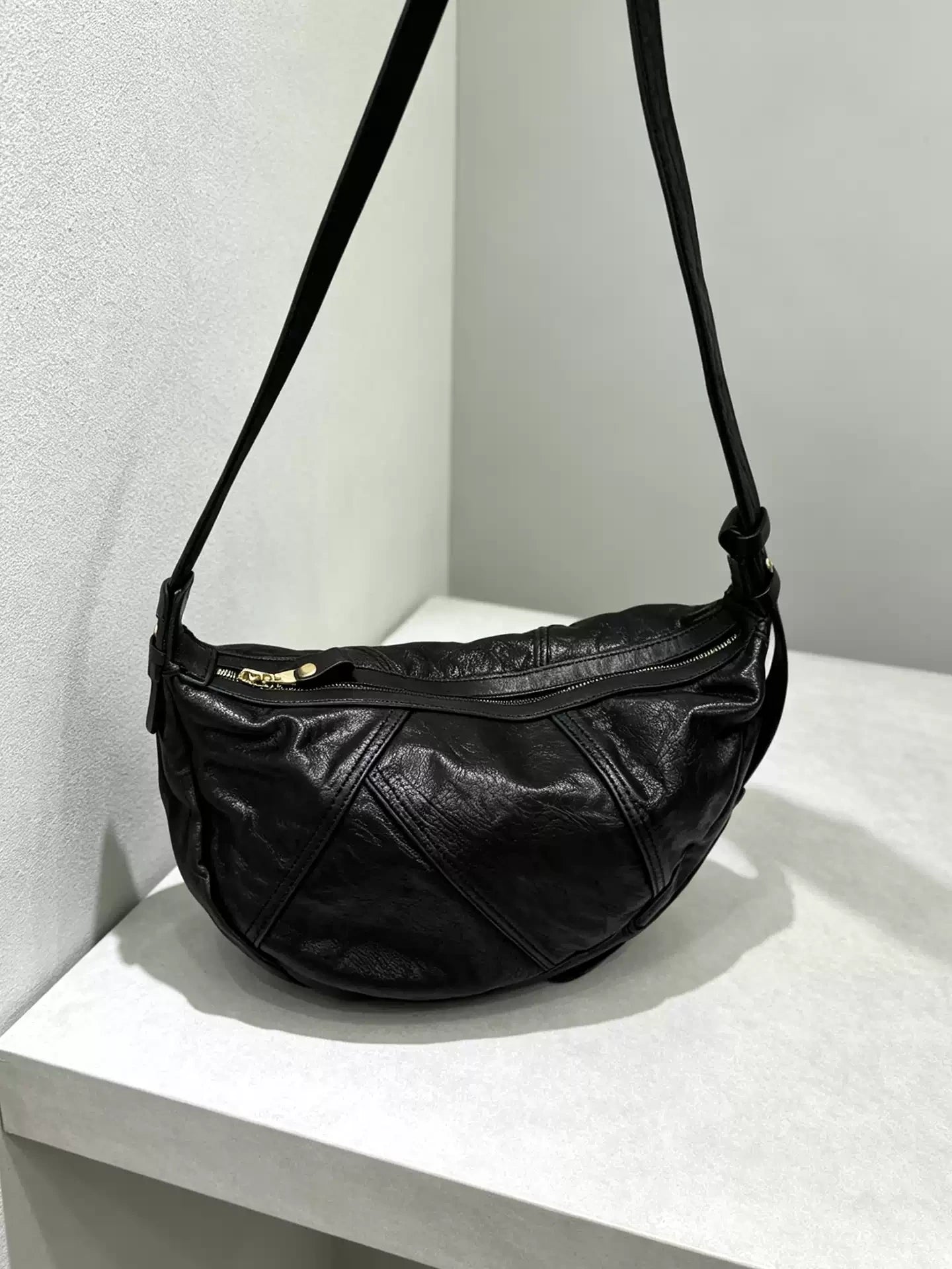 asymmetric vegetable-tanned horsehide bag 4