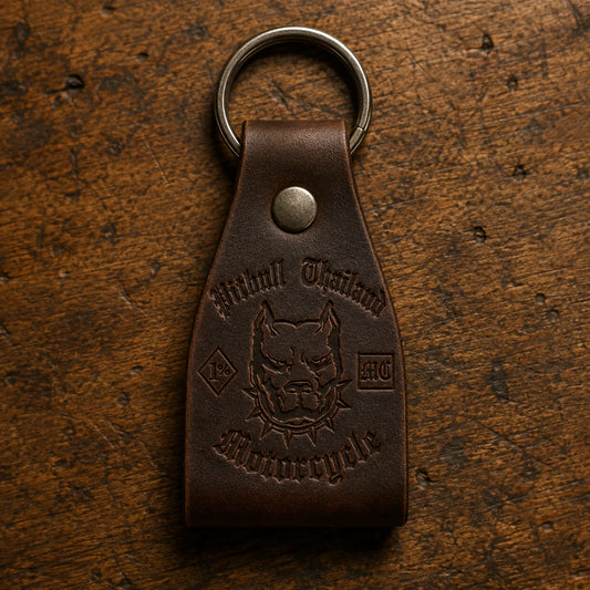 Custom leather biker key fob with an authorized motorcycle club logo, antique nickel rivet and split ring.
