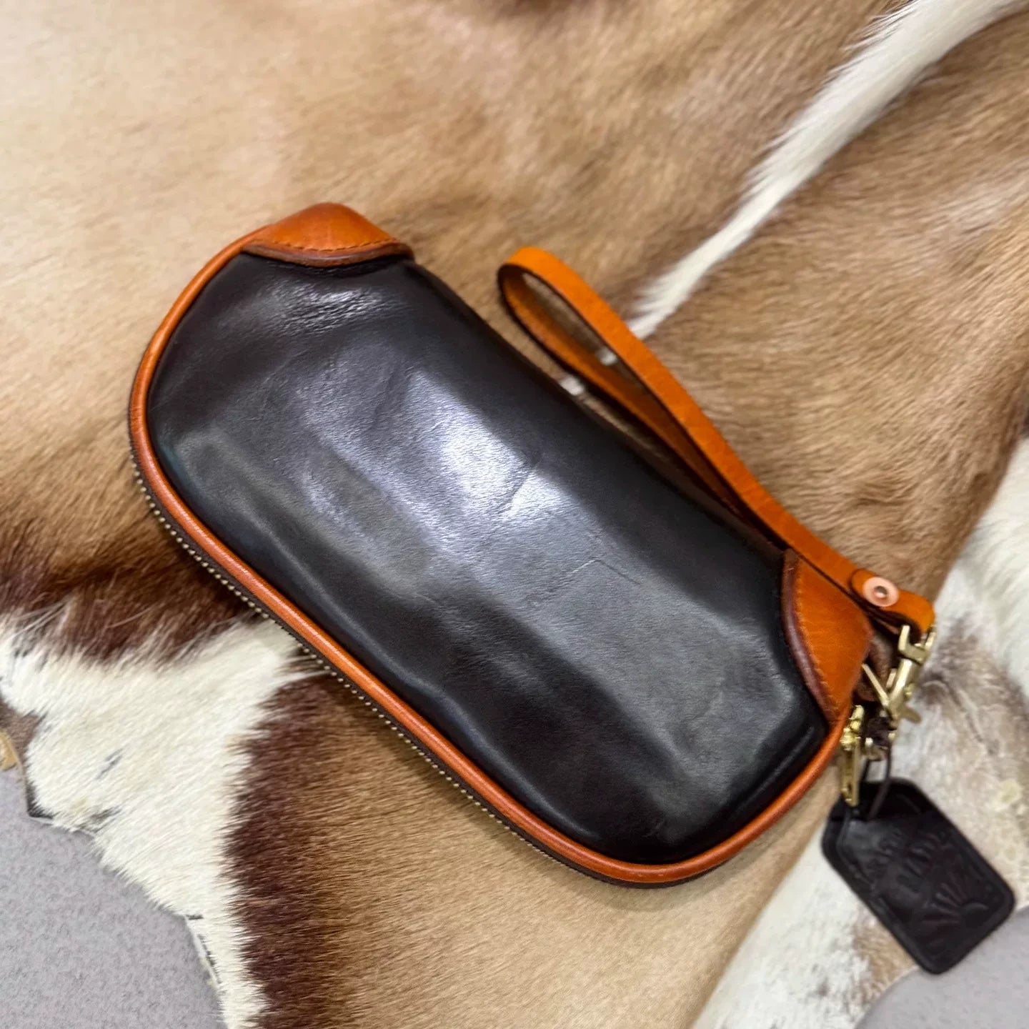hand-distressed leather clutch bag 5