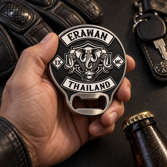 Solid motorcycle club challenge coin bottle opener displayed with riding gloves and keys.