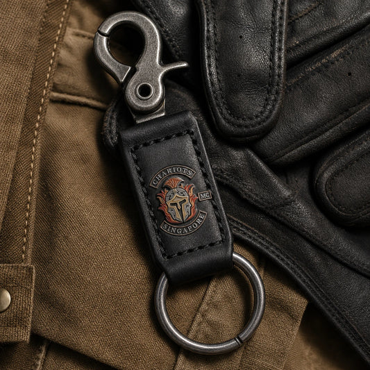 Custom biker belt-clip key keeper with an authorized club logo on a leather tab and gunmetal hardware.