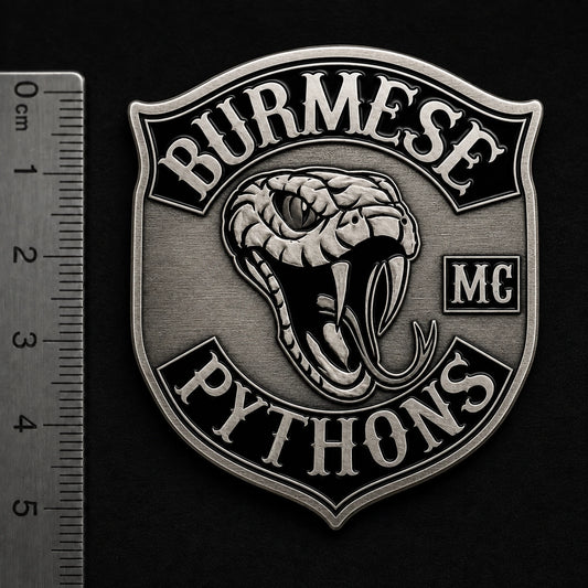 Detailed 1.5 inch motorcycle club pin; non-circular heater shield shape with a solid one-piece metal backplate.