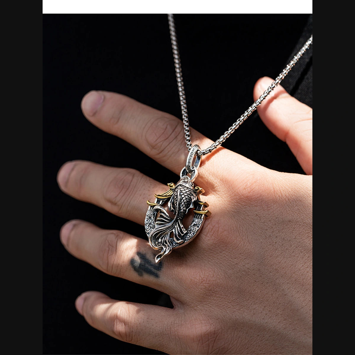3D Koi Dragon Gate Sterling Silver Biker Pendant — side handheld scale view