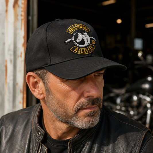 Rider wearing a balanced mid-profile motorcycle club cap with authorized logo embroidery.
