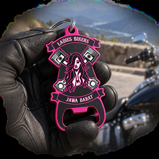 Solid anodized aluminum motorcycle club keychain opener shown at a mountain turnout.