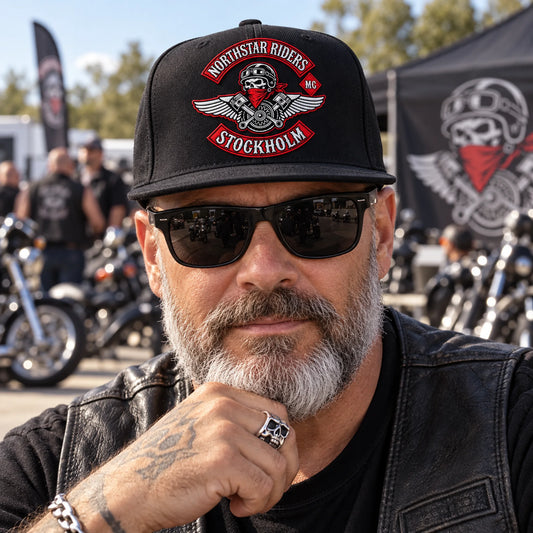High-profile motorcycle club snapback showing a large authorized embroidered club logo.