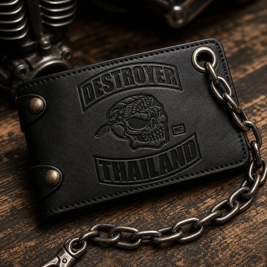 Close view of a reinforced chain-ready grommet on a leather biker wallet carrying an authorized club logo.