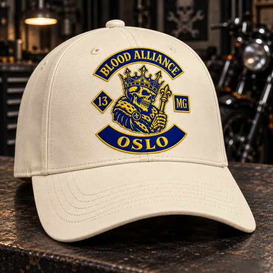 Custom cream motorcycle club baseball cap with a distinct authorized embroidered club logo.