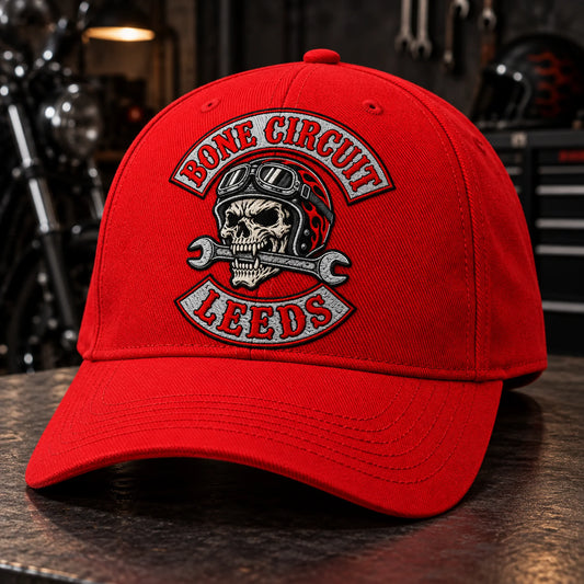 Custom red motorcycle club baseball cap with a distinct authorized embroidered club logo.