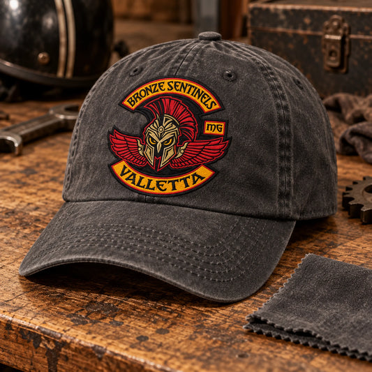 Bronze Sentinels motorcycle club logo embroidered on a soft washed-charcoal cotton cap with a vintage broken-in finish.