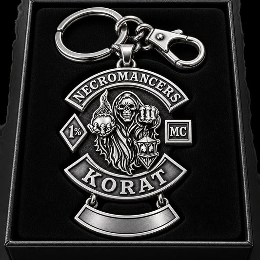 Premium sterling silver motorcycle club officer keychain with deep monochrome relief in a presentation box.