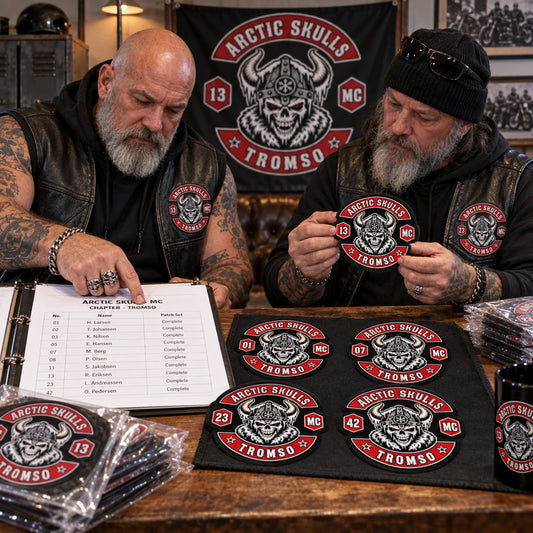 Chapter coordinators reviewing organized personalized diamond patch sets and a member roster for a motorcycle club.