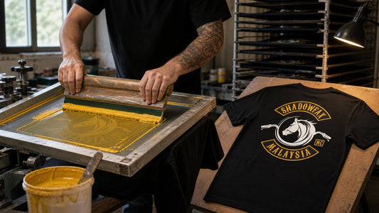 Shadowfax MC Malaysia emblem being screen printed onto a black short-sleeve club T-shirt.