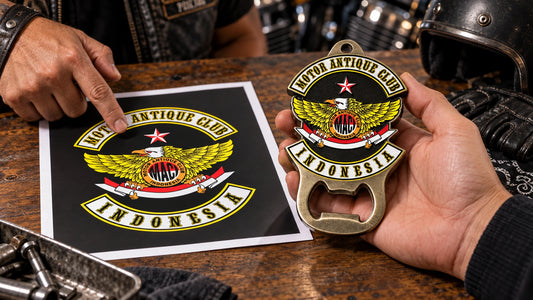 Authorized motorcycle club artwork reviewed beside a solid metal bottle opener sample.