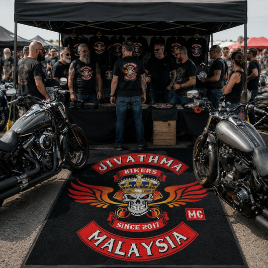 A custom floor rug defines a motorcycle club rally merchandise booth.