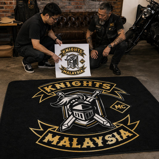 A club representative reviews custom motorcycle club rug artwork with a designer.