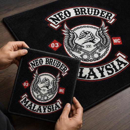 Hands compare a motorcycle club rug sample with the finished design.