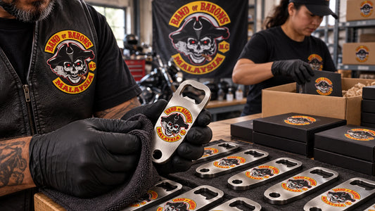 Rows of solid custom motorcycle club bottle openers inspected for a bulk order.
