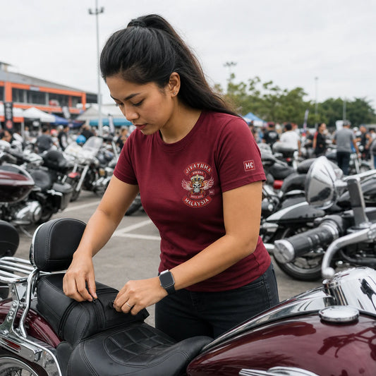 Jivathma Motor Club rider wearing a shaped semi-fitted short-sleeve T-shirt at a motorcycle rally parking area.