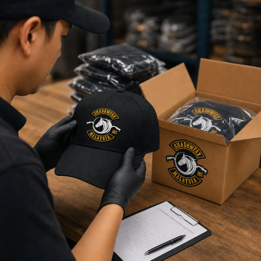 Finished motorcycle club cap with an authorized logo being inspected before worldwide shipping.
