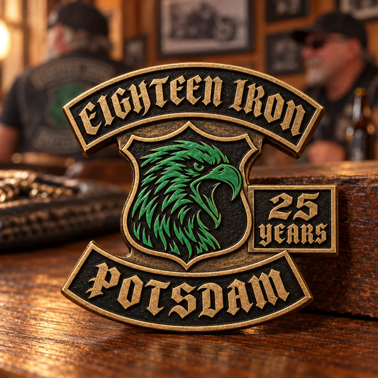 Aged bronze EIGHTEEN IRON anniversary pin with a sculpted eagle and integrated 25 YEARS cartouche.