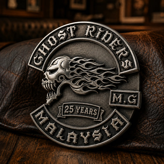 One-piece antique silver GHOST RIDERS anniversary pin with deeply sculpted flaming skull relief and an embossed 25 YEARS milestone cartouche.