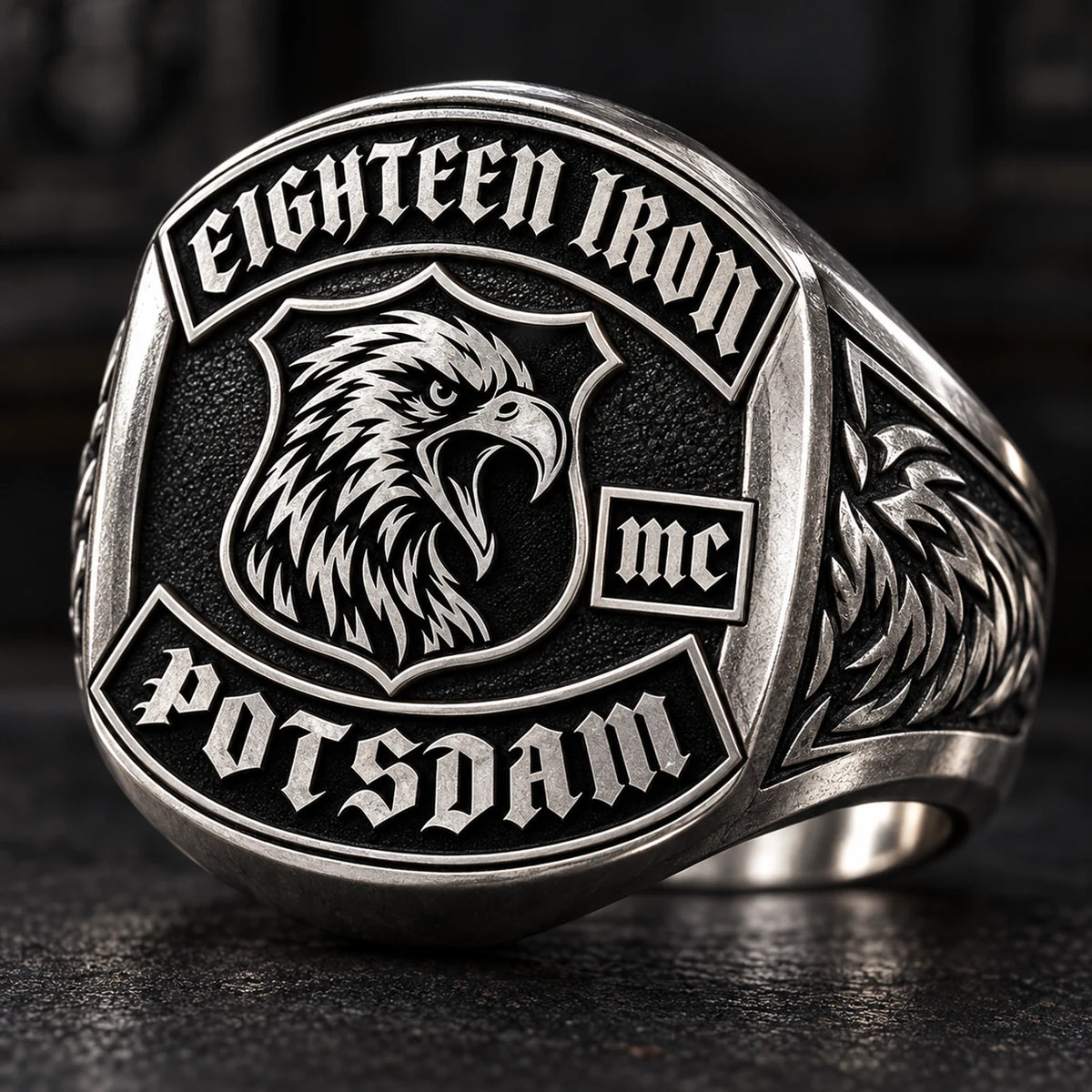 Eighteen Iron anniversary white copper motorcycle club ring with a raised eagle emblem.