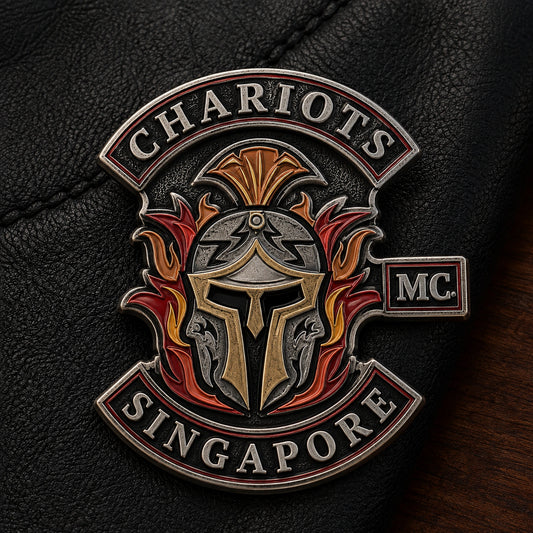 Antique die-struck 2D motorcycle club pin with raised polished details.