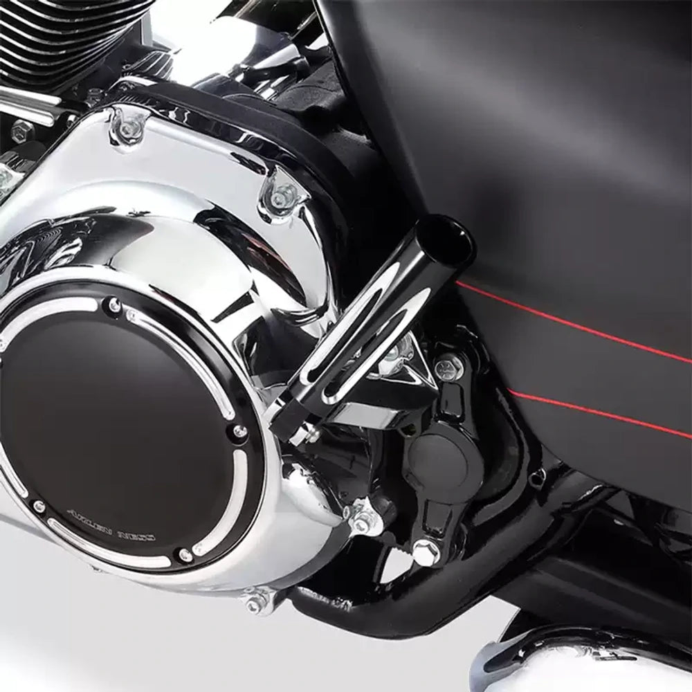 Black Arlen Ness front footboards installed on a Harley Softail motorcycle