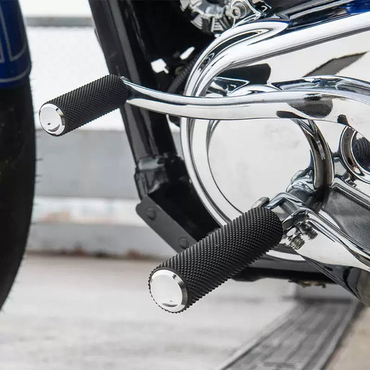 Arlen Ness chrome knurled foot pegs on harley