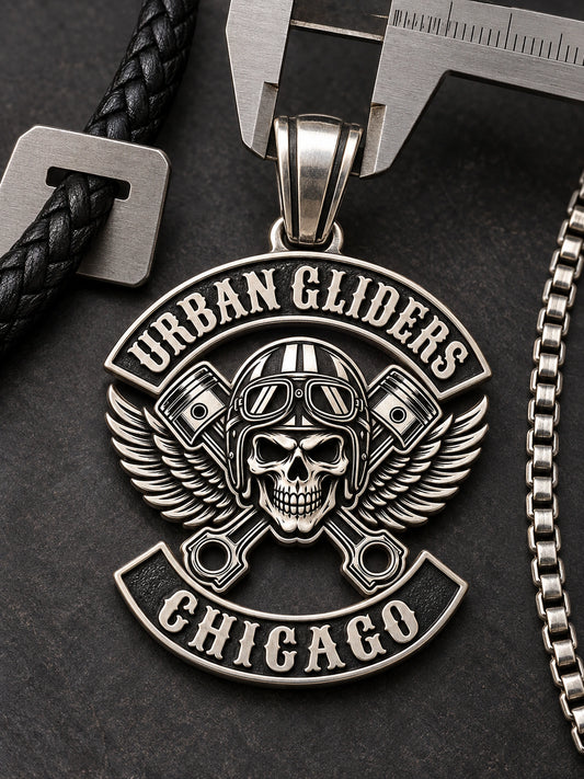 Urban Gliders Chicago custom motorcycle club pendant with its bail opening measured beside a box chain and leather cord.