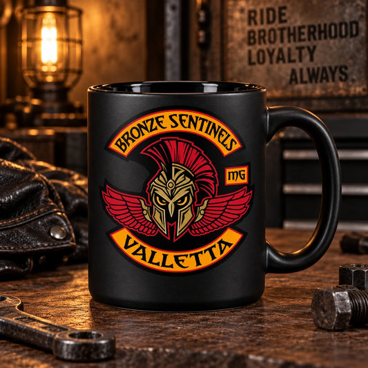Complete matte-black ceramic biker mug with glossy interior and bold club emblem, moody garage shelf lighting.
