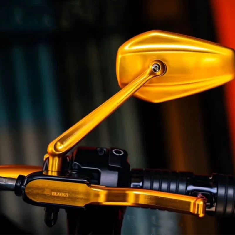 Gold BLACK3 3-finger lever installed on motorcycle