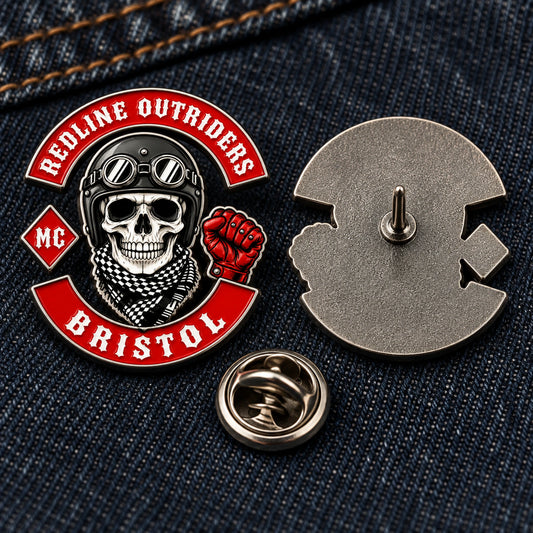 Compact REDLINE OUTRIDERS pin shown with a straight post and butterfly clutch on denim.